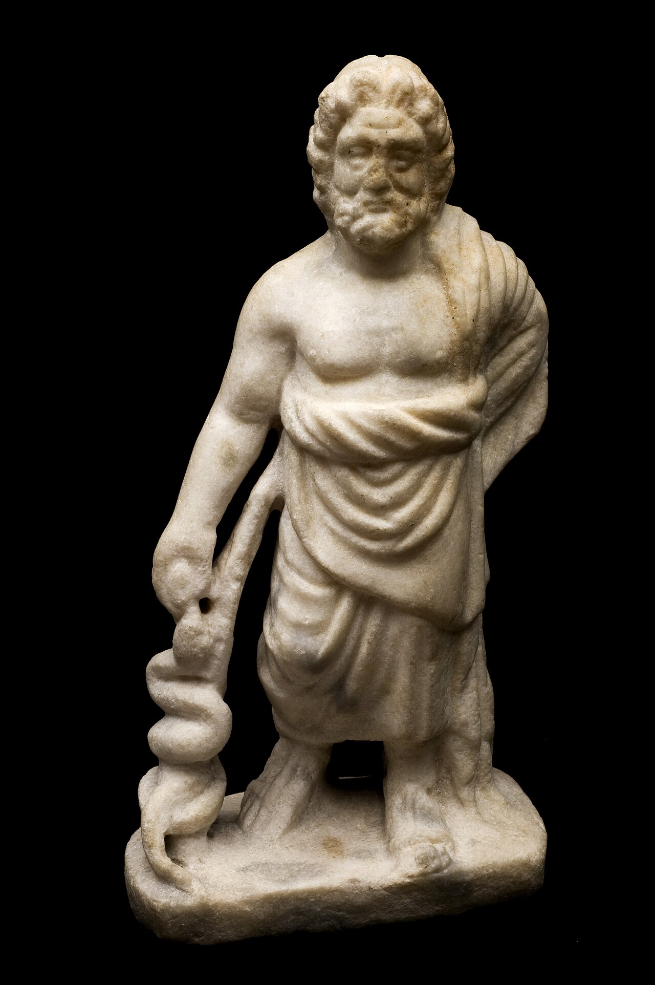 Ancient Greek marble statue of Asclepius, the god of medicine, holding a staff with a serpent